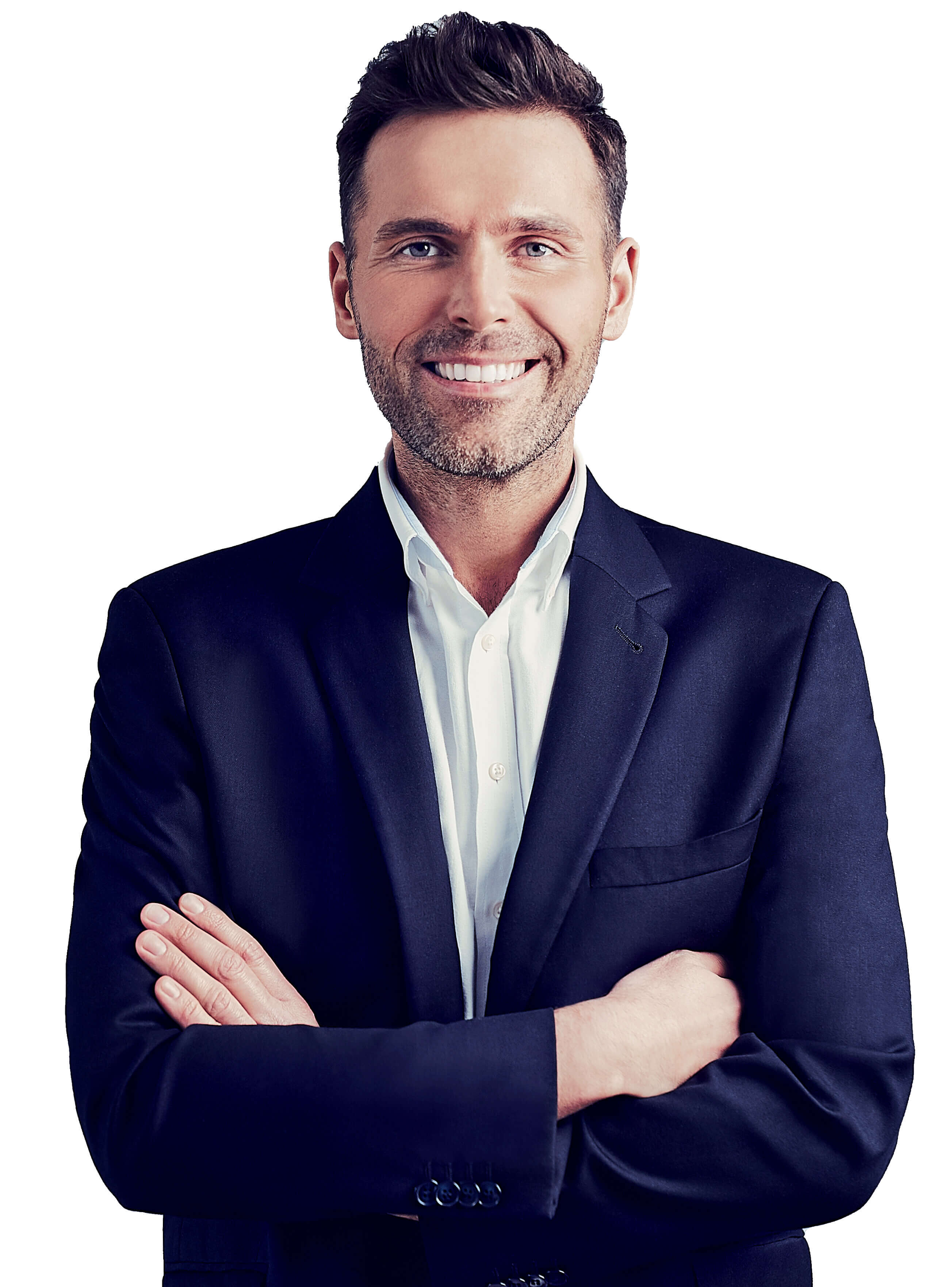 Portrait of a smiling man in a dark suit with arms crossed, standing against a white background.